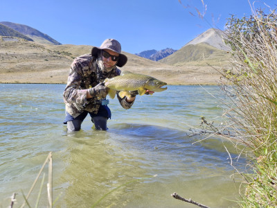 CSIRLjan2026.01 ‘A fat high country brown trout caught on a grasshopper imitation on a hot, windy afternoon’  Photo Rhys Adams F