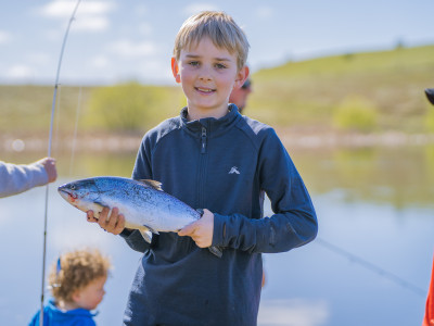CSIRLnov2025 01 Oliver Currell with salmon fresh out of Loch Cameron on Kid’s Fishing Day Photo by Braided Creative