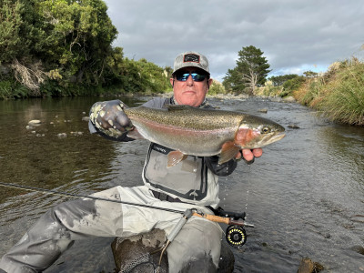 Jack Alvernaz with a solid hatchery fish from last season, by TnT Guided Fly Fishing NZ