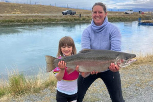 WFR2526.202 Nikola Harrington with a 17.5 lb trout she caught with her husband and daughter at the Tekapo Canal