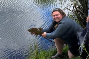 WFR2526.70 CSI Fish & Game staff member Nikki Dellaway with her first ever Tench! An impressive 4.5lbs fish.