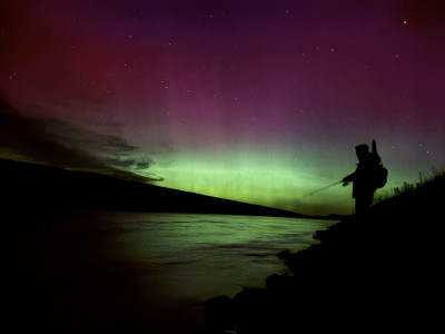 WFR2526.216  Brothers Jake and Ben Bransgrove fishing under the southern lights at the Tekapo Canal. Photo J Bransgrove.