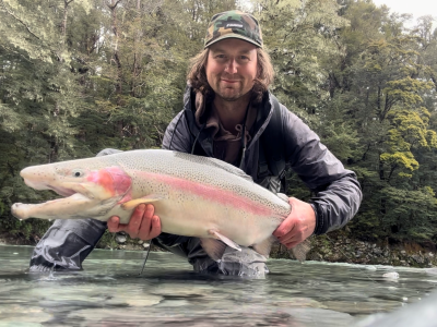 Lowell smyth with 14lb rainbow caught on olive wolly bugger