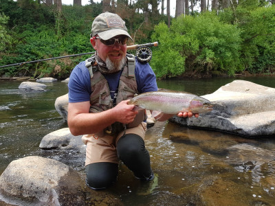 TRL1April18. Curly McEwen admires a well conditioned wild rainbow from the Waingongoro River Photo Tarn Mack McEwen