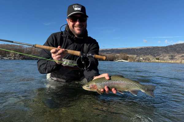 OT   Sam Fisher with a winter rainbow trout caught on a spey rod on the Upper Clutha River Mata Au in Otago region. Credit Dan Root